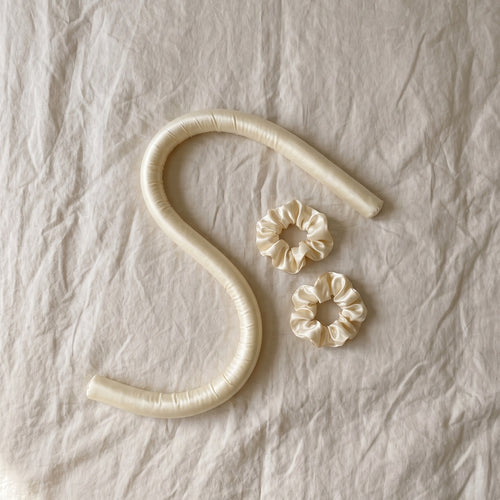 Satin curl rod in an S-curve with scrunchies on linen