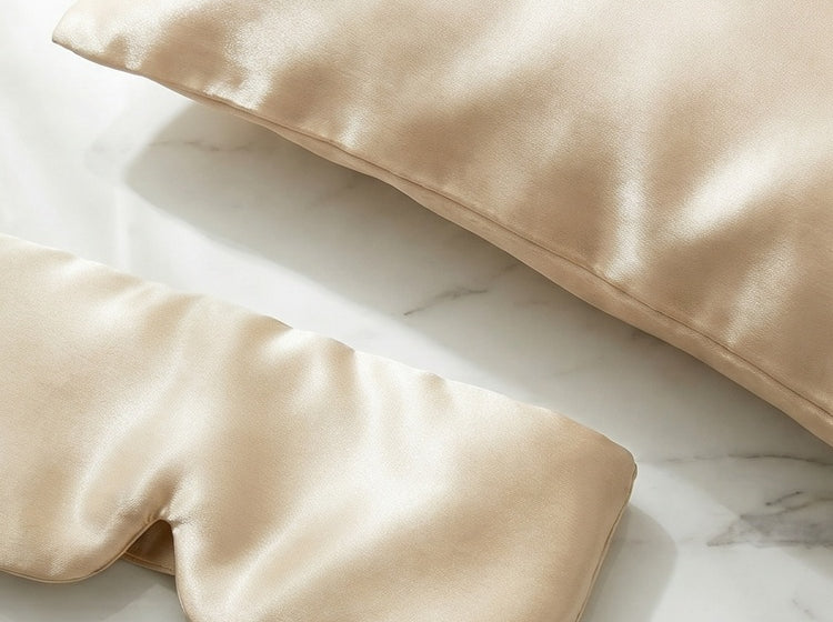Curalp silk pillowcase and eye mask on marble