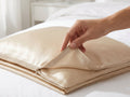 Curalp silk zipper pillowcase on a bed